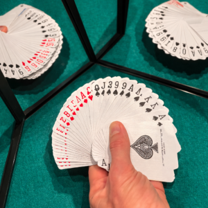 Deck of cards fanned out on green baize, illustration for the Magic & Sales keynote