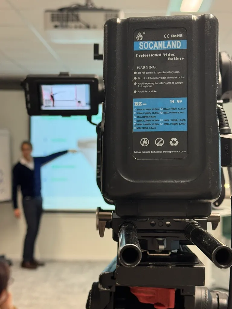 Vincent Flament, founder of Valorize Solutions, on stage during a keynote, filmed by a professional camera for a live broadcast.